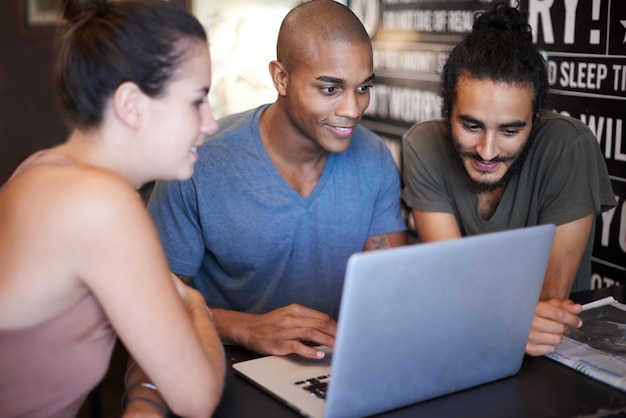 A diverse group of professionals is participating in a training session or workshop. The room is well-lit and equipped with modern technology.