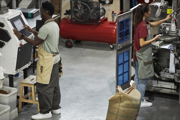 An image of a modern factory floor in Brazil, with automated machinery and workers in lab coats monitoring production. The image highlights the adoption of Industry 4.0 technologies in the Brazilian manufacturing sector.