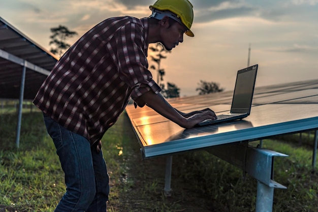 A person working on solar panel installation, highlighting the job creation and economic opportunities in the renewable energy sector in Brazil. The focus is on the worker and the equipment, showcasing a blend of technology and manual labor.