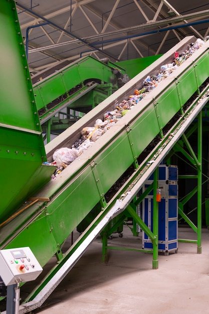 A modern and efficient recycling plant with automated sorting lines, showcasing technological advancements in waste management and resource recovery.