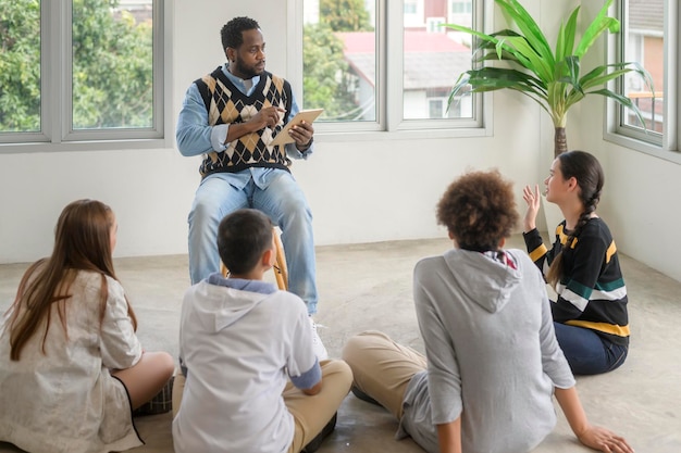 A group of students participating in a peer mediation session, facilitated by a school counselor. The students are sitting in a circle, engaged in a constructive dialogue, learning to resolve conflicts peacefully and respectfully.