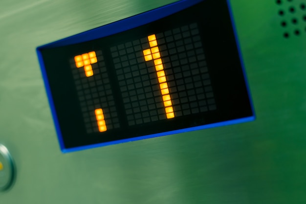 a close-up shot of a Petrobras stock ticker on a digital display board, with the stock price showing a significant decline, symbolizing the financial strain caused by government price controls