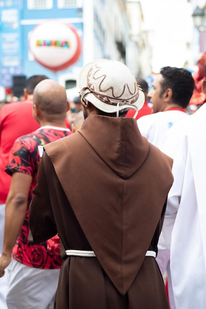 Procession during the Festa do Divino Espírito Santo in Pirenópolis, Brazil, showing the colorful costumes and religious symbols.