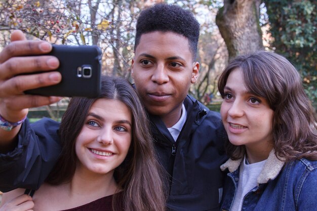 A photograph capturing a young, diverse group of students passionately discussing Itamar Vieira Junior's 