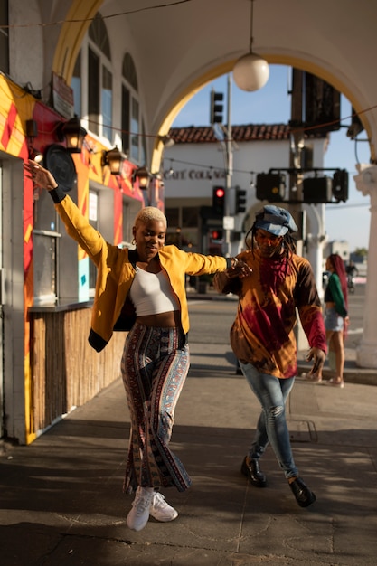 A still from a modern Brazilian film showcasing a vibrant street scene in Salvador, Bahia, with Afro-Brazilian characters dressed in traditional clothing, celebrating their cultural heritage.