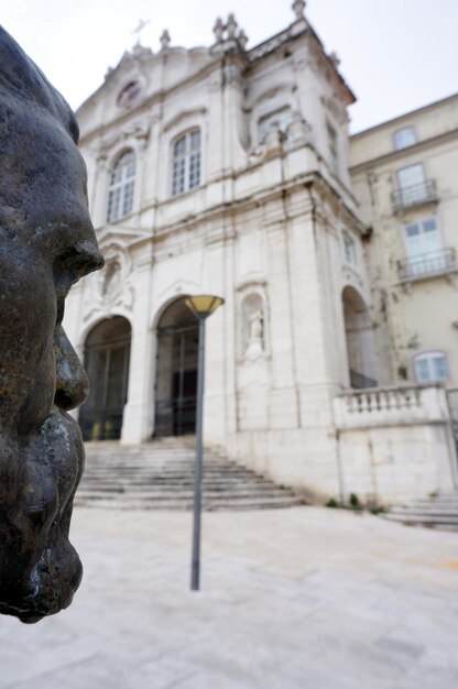 The Museu da Inconfidência in Ouro Preto, Minas Gerais. The museum is housed in a historic colonial building with a white facade and wooden windows. The museum stands at the city of Ouro Preto, surrounded by mountains and other colonial buildings.