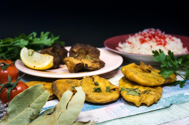 A high-angle shot of a table filled with a variety of Afro-Brazilian dishes, including acarajé, vatapá, moqueca, and caruru. Each dish is served in colorful bowls and garnished with fresh herbs.