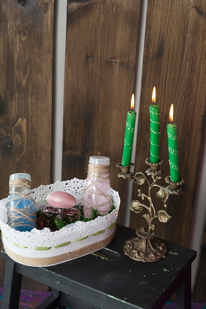 An eye-level shot of a Umbanda altar adorned with candles, statues of saints, offerings of food like rice and fruits, and ritual objects such as beads and feathers, creating a colorful and spiritual atmosphere.