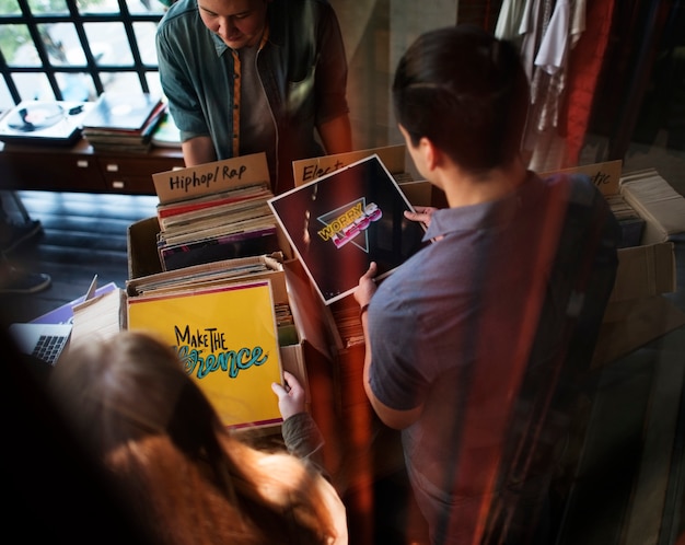A digital marketing team brainstorming ideas for a Carnival social media campaign, using analytics dashboards and creative content on a large screen.