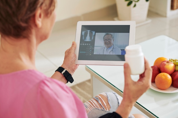 A tablet displaying a telehealth consultation, with a doctor on screen and a patient at home, illustrating the innovative approaches to healthcare being encouraged by the bill.
