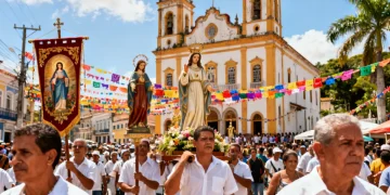 Procissão religiosa com fiéis carregando imagens de santos em uma rua festiva no Brasil, com uma igreja ao fundo.